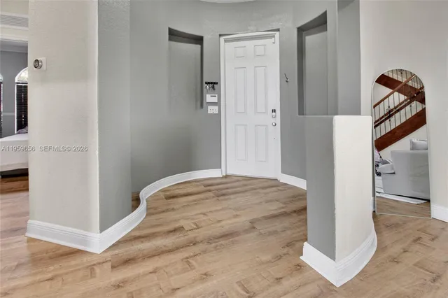 a bedroom with a bed and a hallway