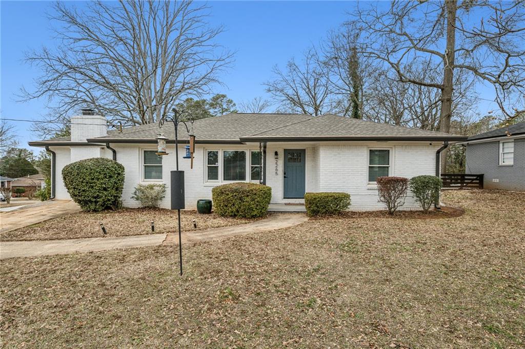 2265 Starline Drive Decatur, GA 30032 - Photo 1 of 1 a backyard of a house with table and chairs