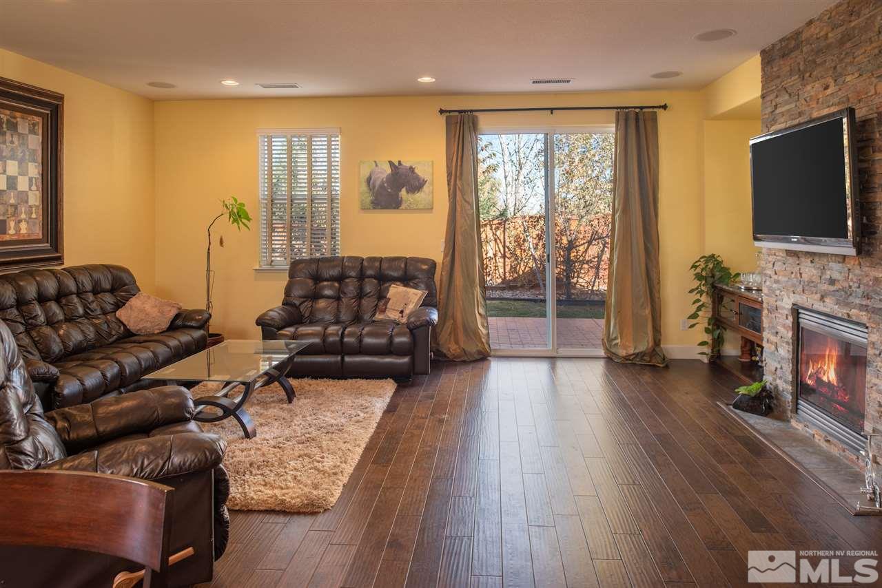 301 Manciano Way Reno, NV 89521 - Photo 5 of 20 a living room with furniture and a flat screen tv