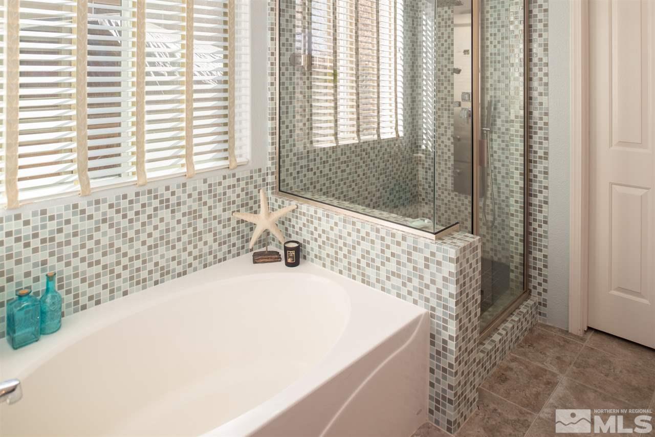 301 Manciano Way Reno, NV 89521 - Photo 10 of 20 a bathroom with a bathtub and shower