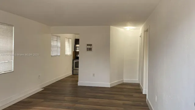 a view of wooden floor in an empty room