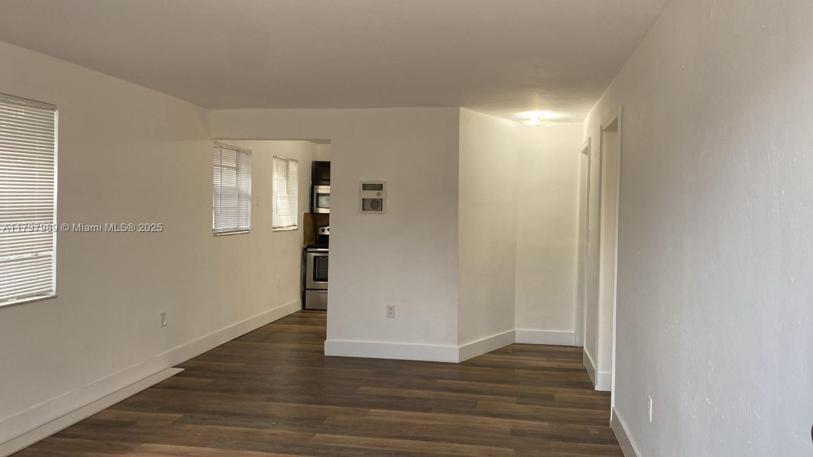 1173 Northwest 65th Street Miami, FL 33150 - Photo 3 of 7 a view of wooden floor in an empty room