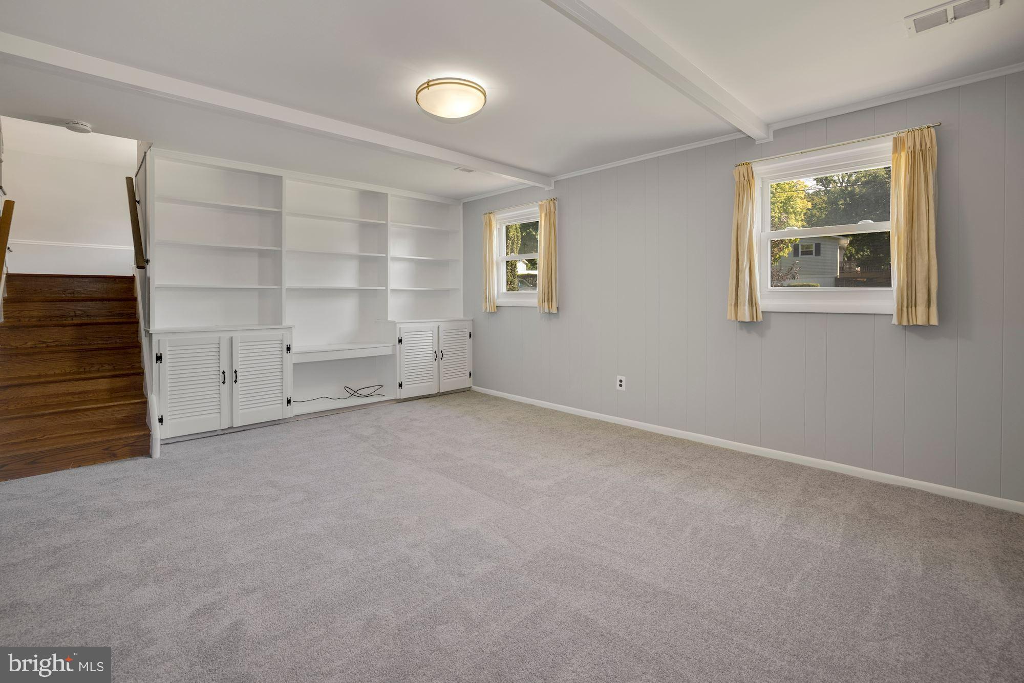 4105 Weller Road Silver Spring, MD 20906 - Photo 20 of 29 LOWER LEVEL LIVING AREA W/ BUILT-IN BOOKCASES