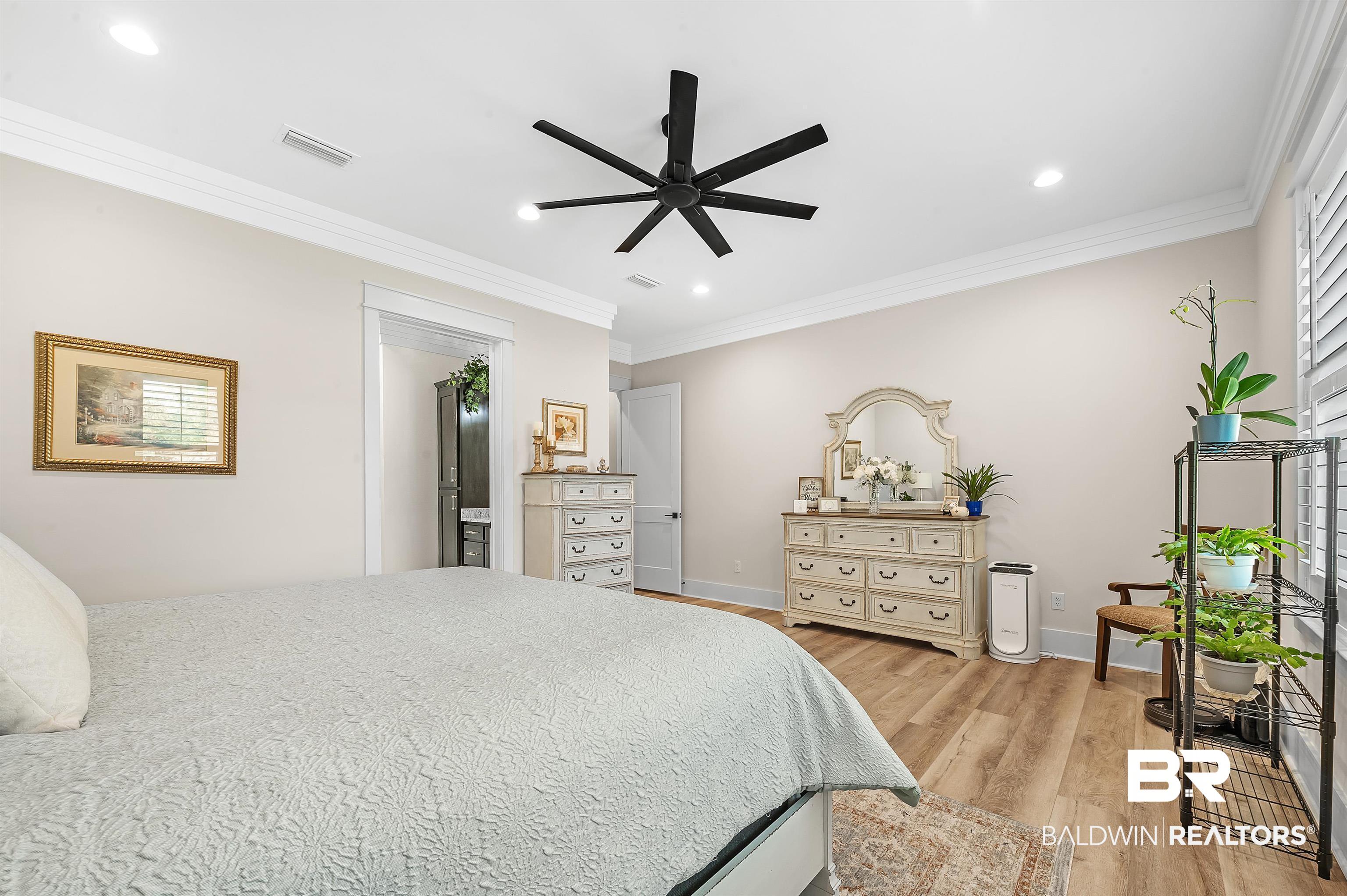 9144 Harvest Ridge Fairhope, AL 36532 - Photo 30 of 58 Bedroom with baseboards, visible vents, light wood-style floors, ornamental molding, and recessed lighting