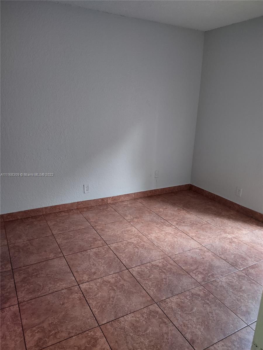 4445 Treehouse Lane, Unit A Tamarac, FL 33319 - Photo 15 of 16 a view of an empty room