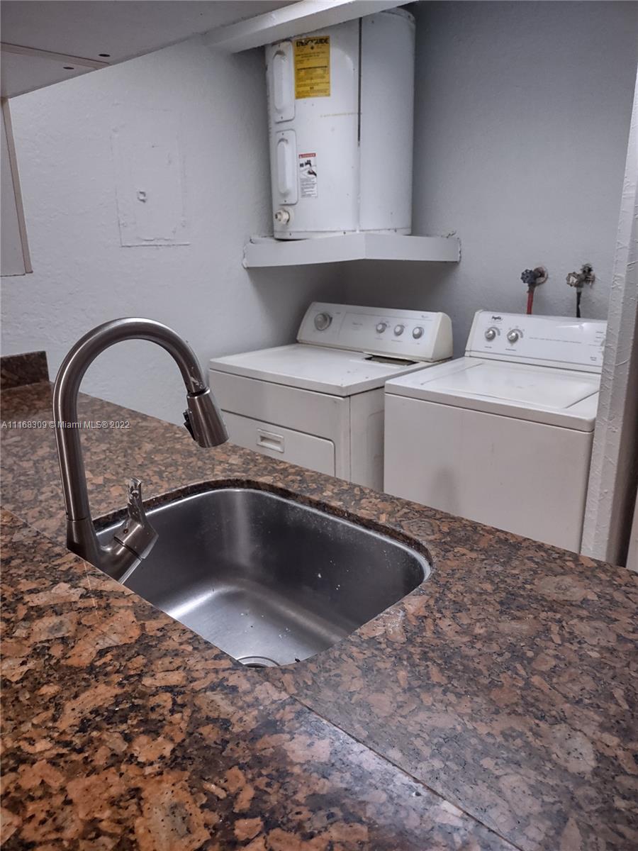 4445 Treehouse Lane, Unit A Tamarac, FL 33319 - Photo 6 of 16 a close view of sink and tap