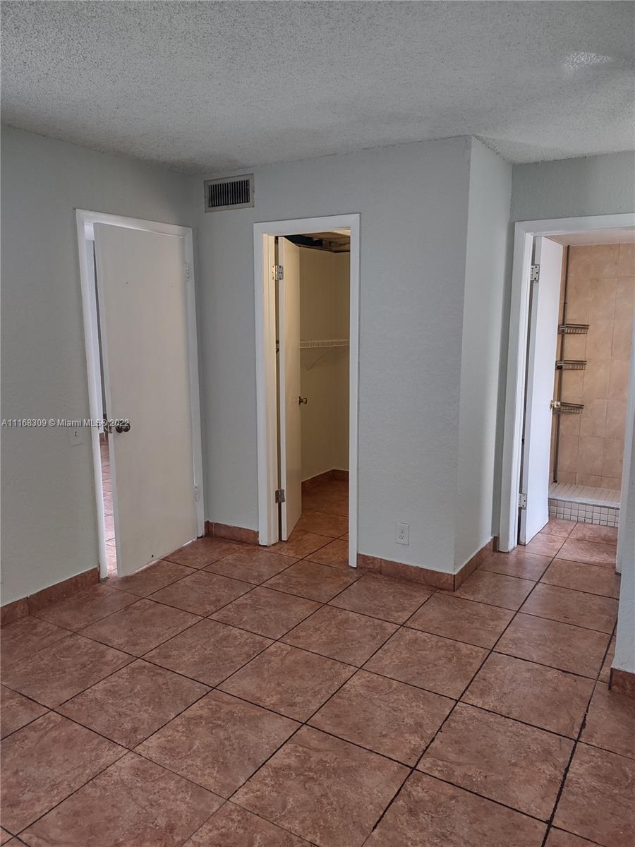 4445 Treehouse Lane, Unit A Tamarac, FL 33319 - Photo 9 of 16 a view of an empty room