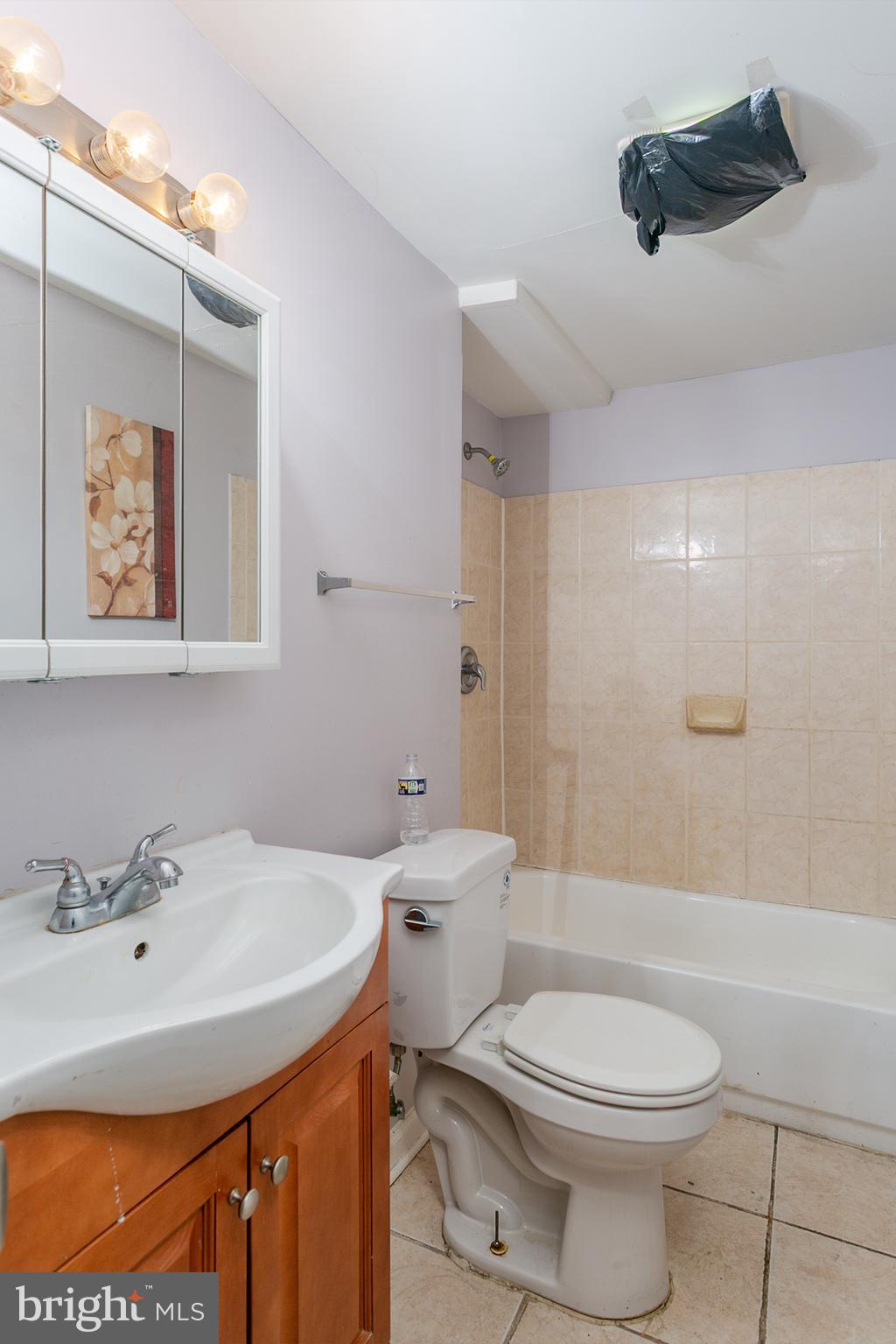 1217 Division Street Baltimore, MD 21217 - Photo 11 of 14 a bathroom with a sink toilet and shower