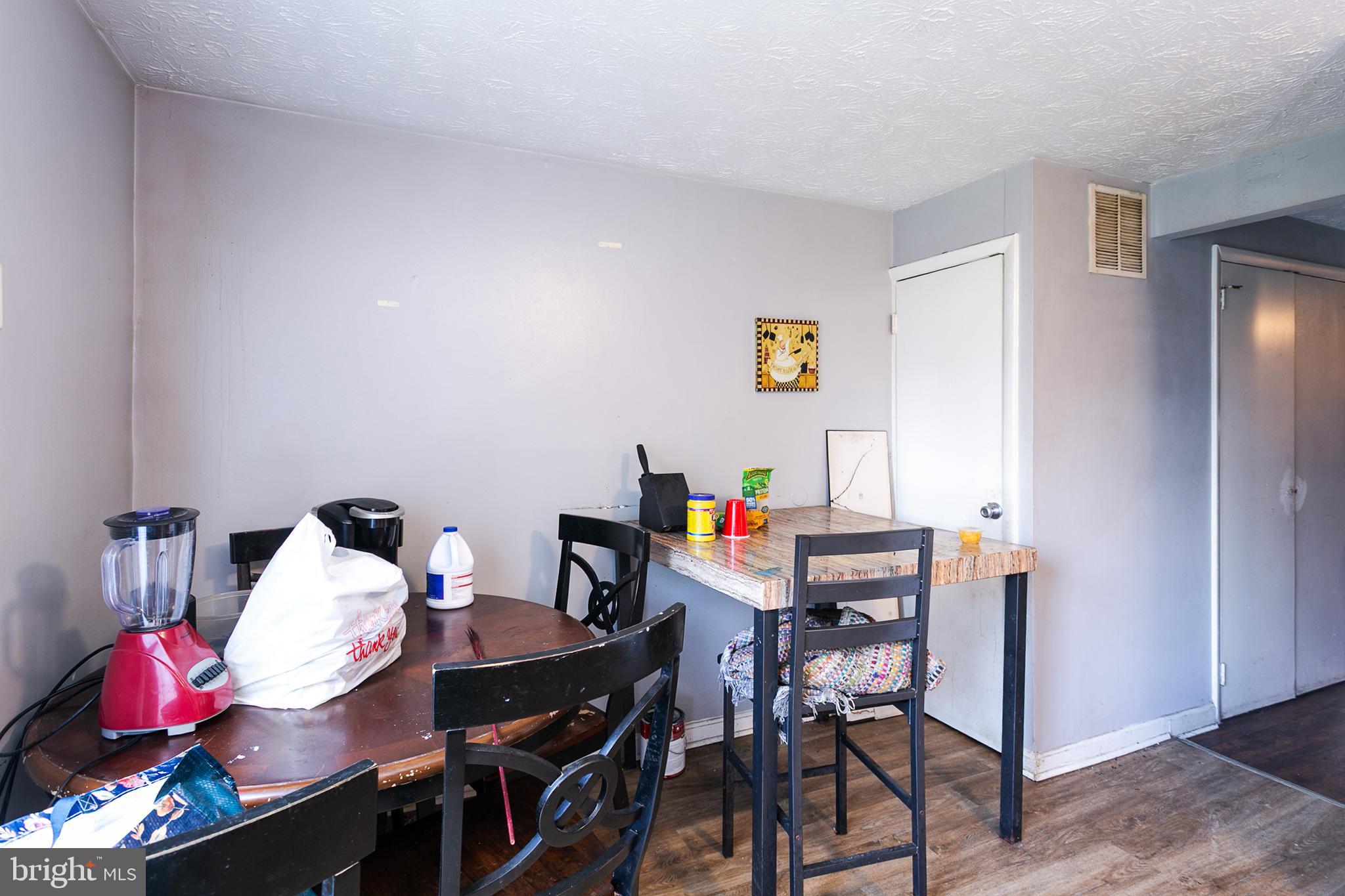 1217 Division Street Baltimore, MD 21217 - Photo 4 of 14 a view of a workspace with furniture