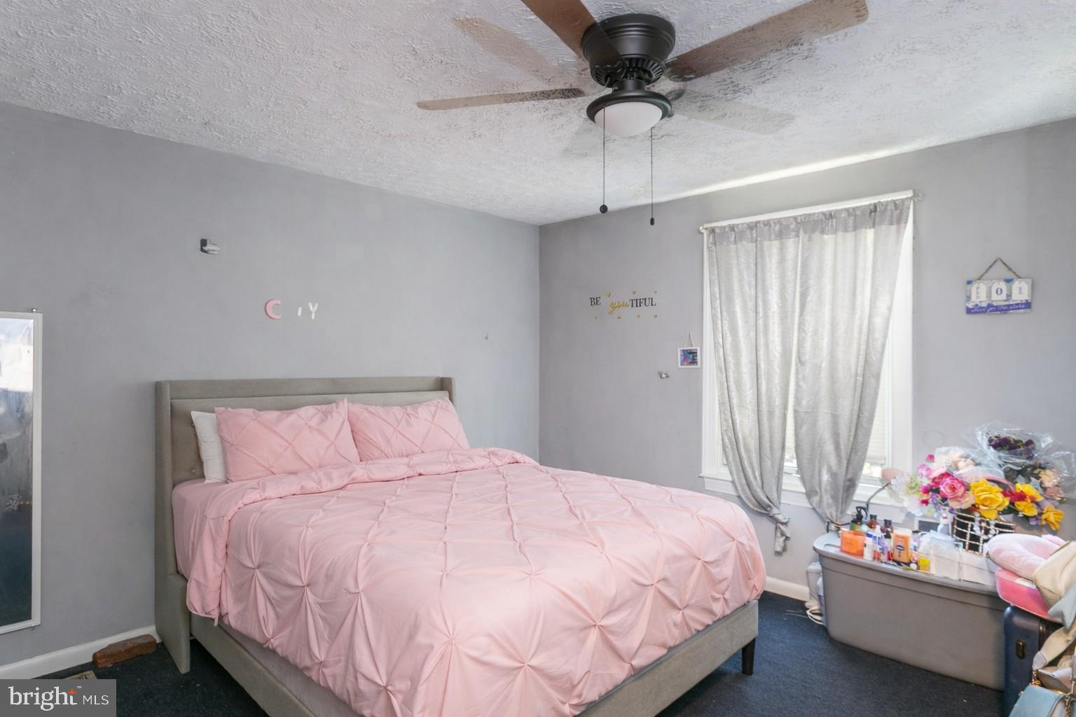 1217 Division Street Baltimore, MD 21217 - Photo 6 of 14 a bedroom with a bed and a window