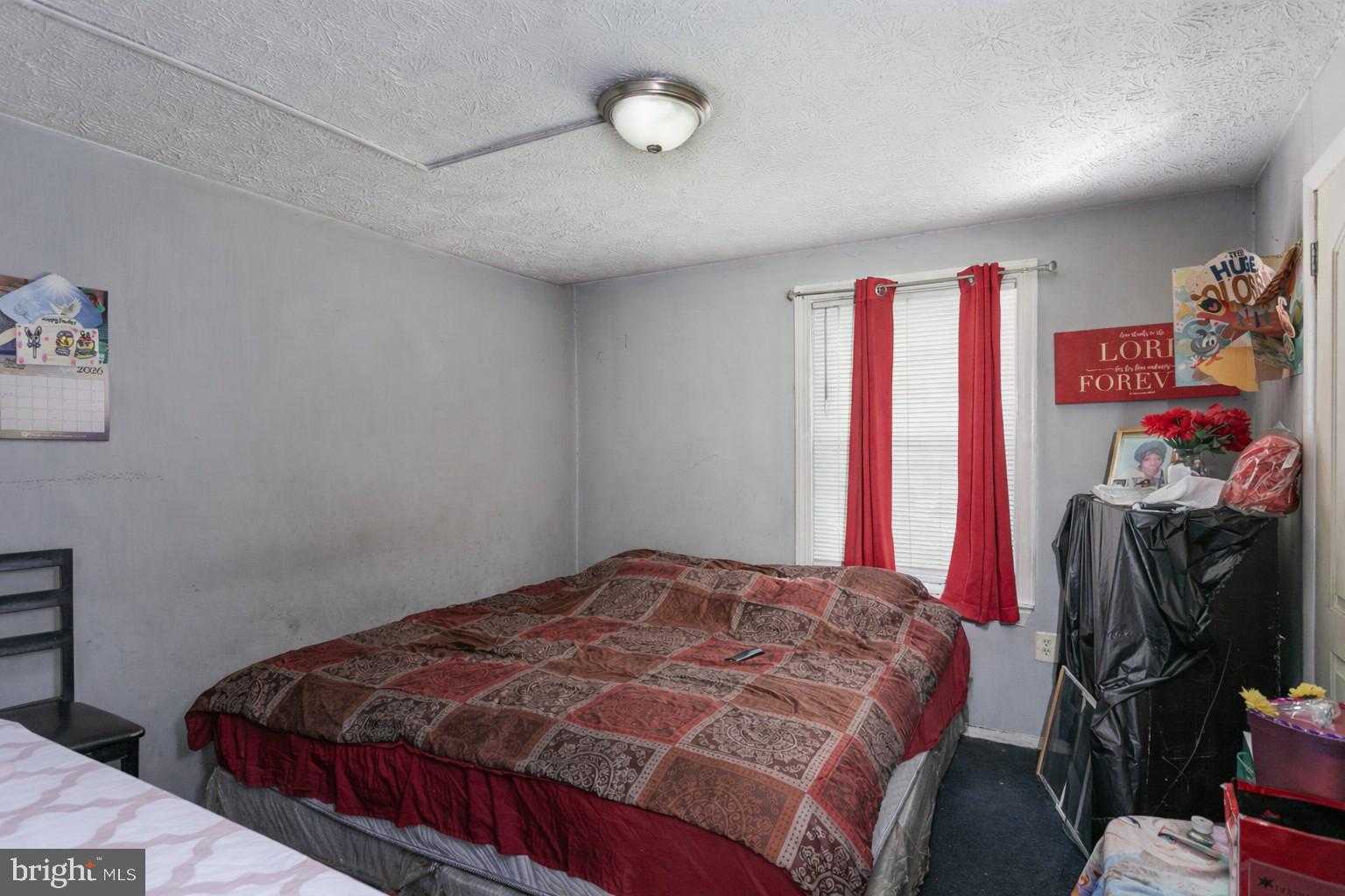 1217 Division Street Baltimore, MD 21217 - Photo 10 of 14 a bedroom with a bed and a closet