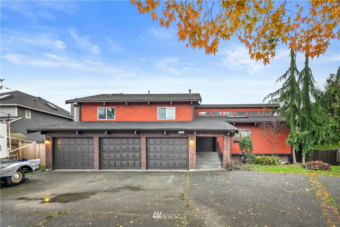 10316 Vernon Road Lake Stevens, WA 98258 - Photo 1 of 25 a front view of a house with a yard and garage