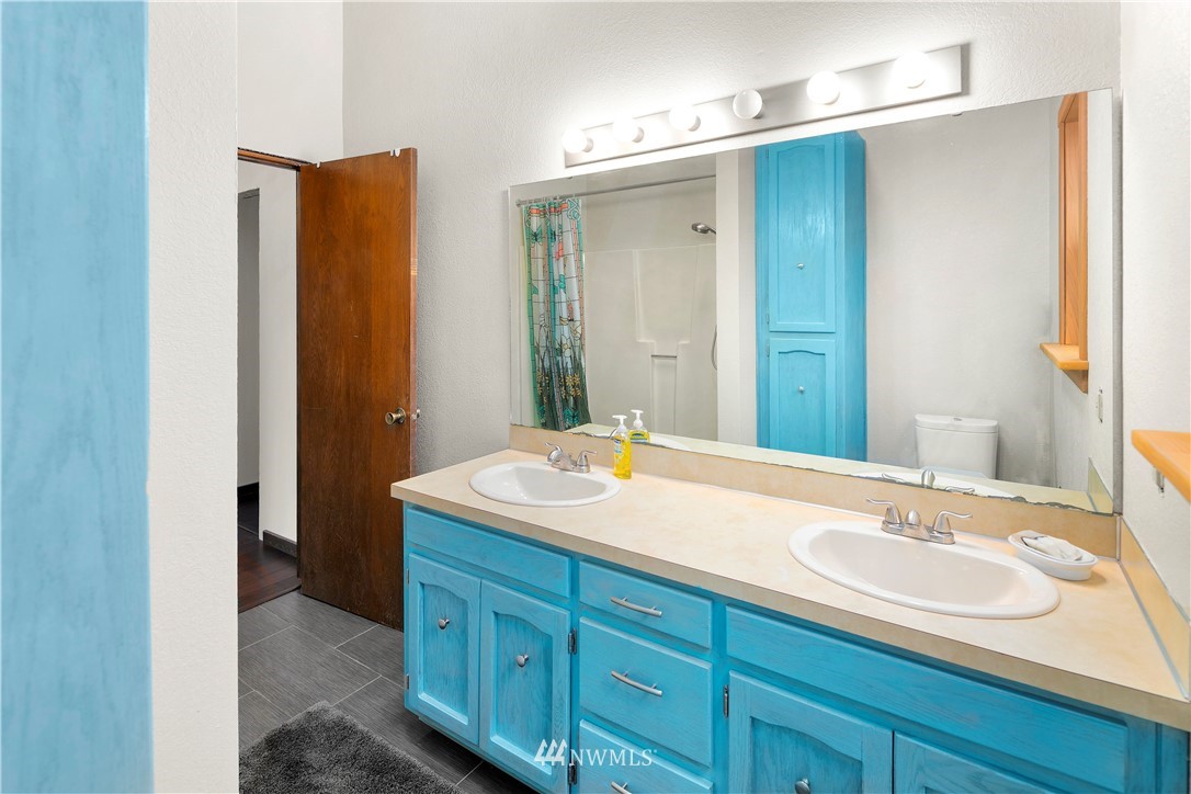 10316 Vernon Road Lake Stevens, WA 98258 - Photo 11 of 25 a bathroom with a sink and a mirror