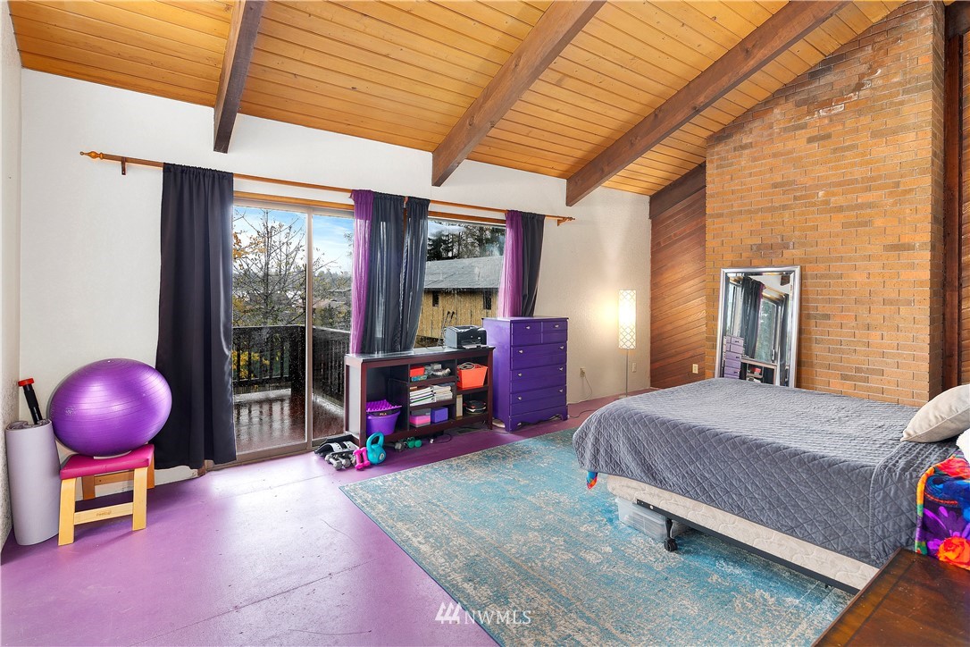 10316 Vernon Road Lake Stevens, WA 98258 - Photo 12 of 25 a bedroom with a bed and large windows