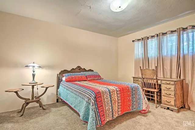 a bedroom with a bed and cabinets