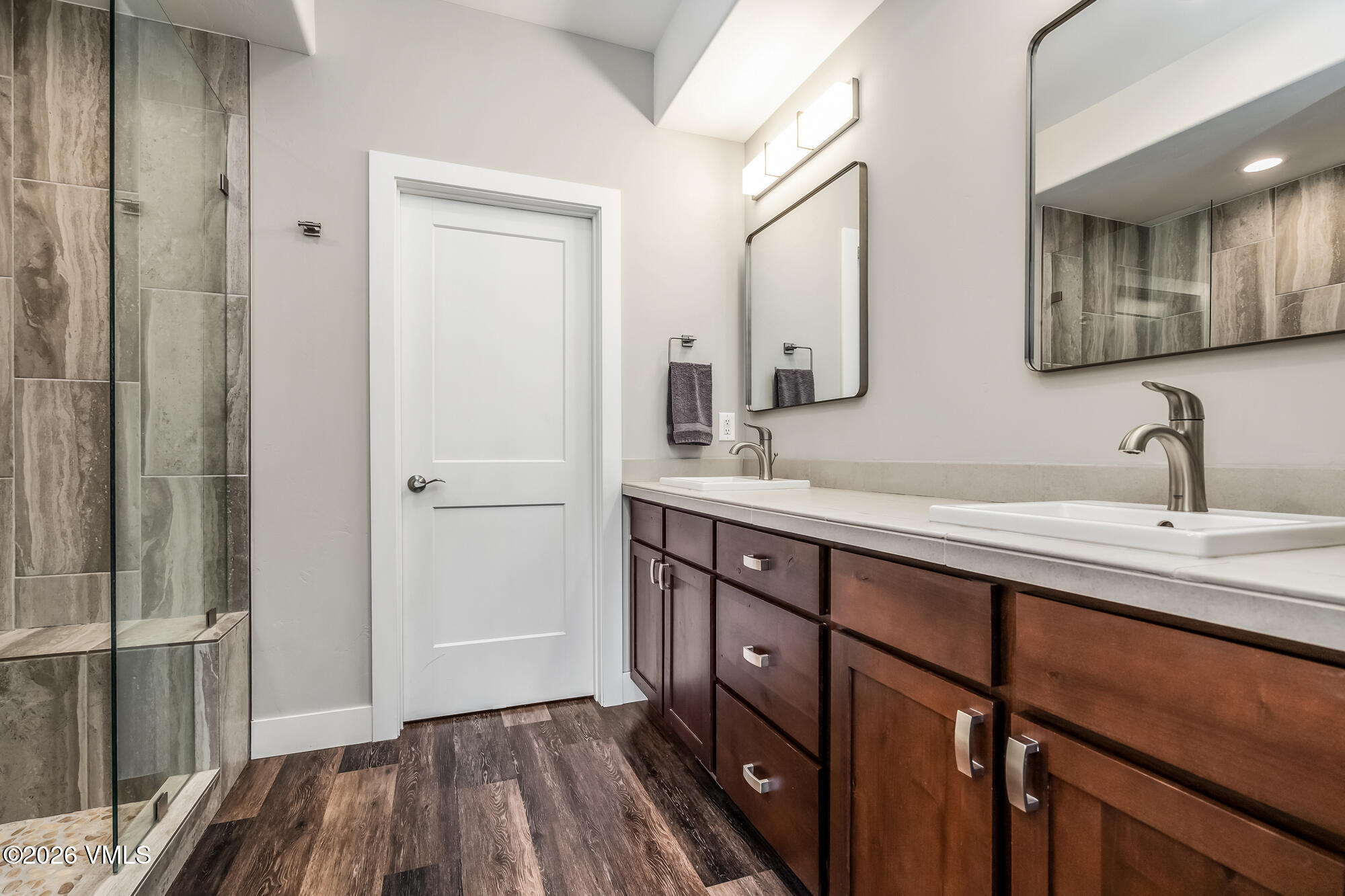 54 Field Street Eagle, CO 81631 - Photo 16 of 36 a bathroom with a double vanity sink and a mirror