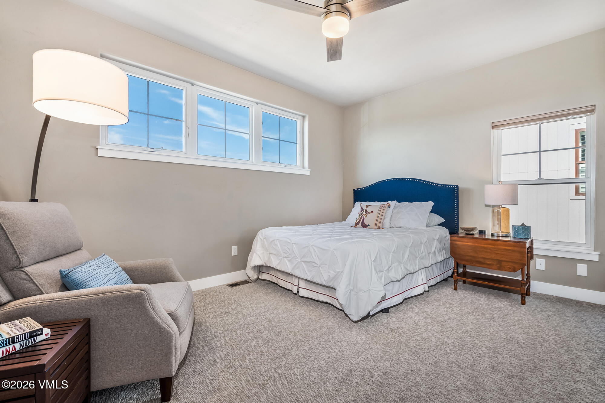 54 Field Street Eagle, CO 81631 - Photo 19 of 36 a bedroom with a bed lamp and a fireplace