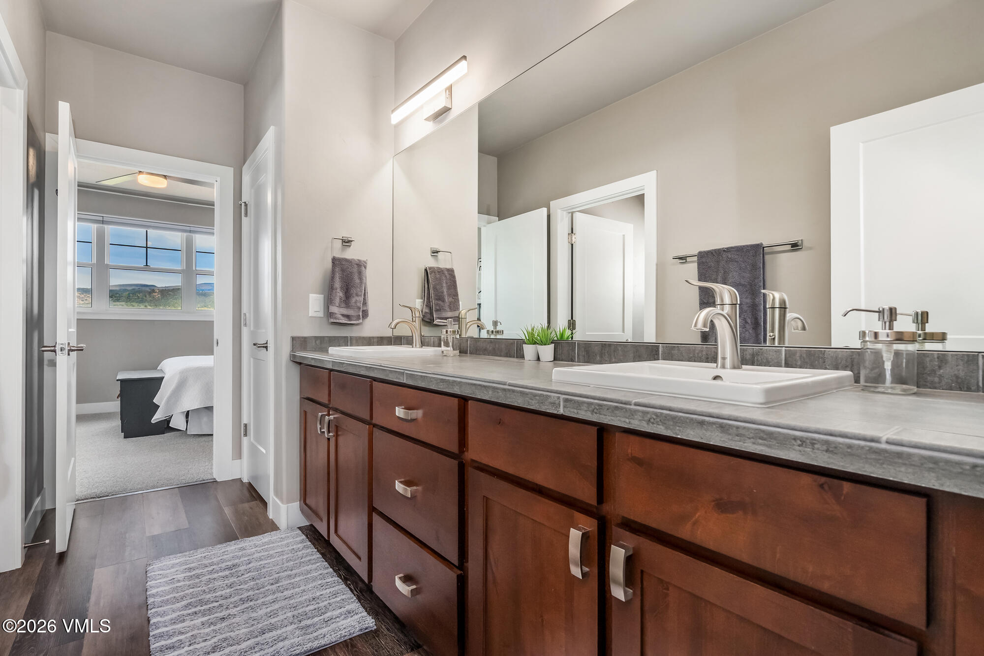 54 Field Street Eagle, CO 81631 - Photo 20 of 36 a bathroom with a double vanity sink and mirror