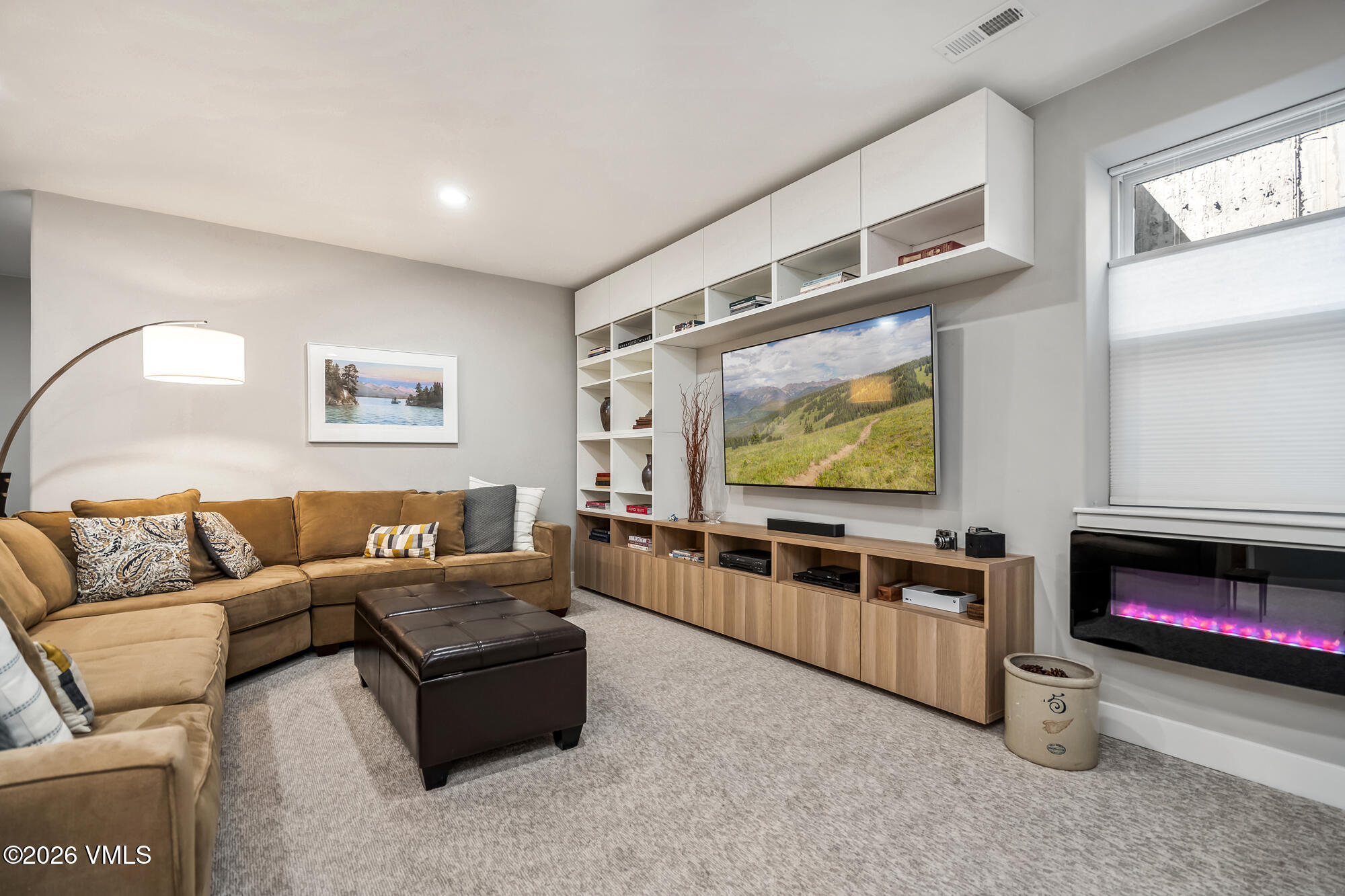 54 Field Street Eagle, CO 81631 - Photo 25 of 36 a living room with furniture and a flat screen tv