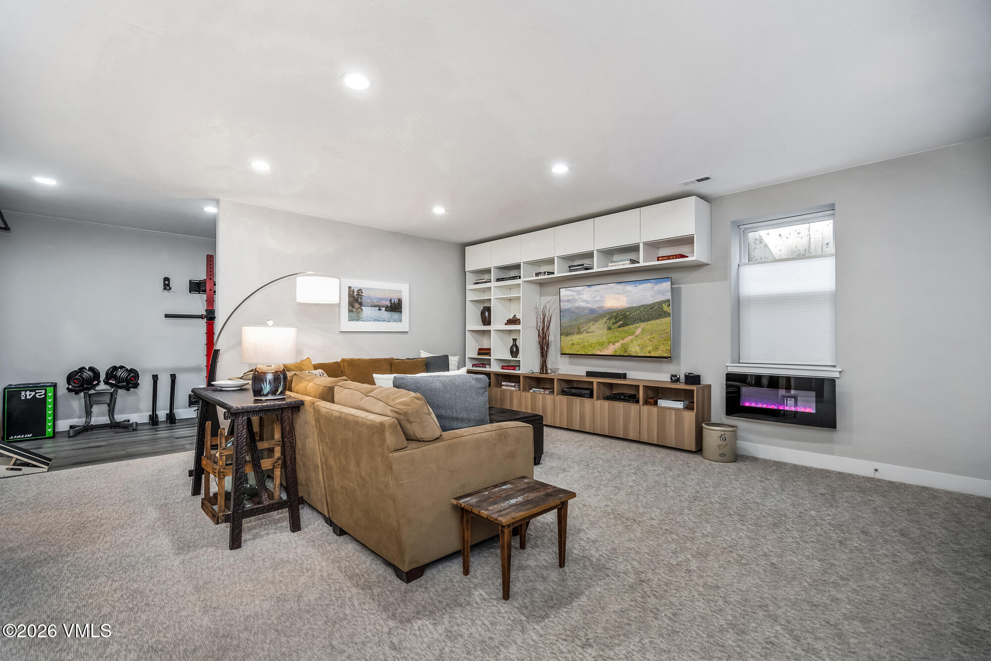 54 Field Street Eagle, CO 81631 - Photo 26 of 36 a living room with furniture and a flat screen tv