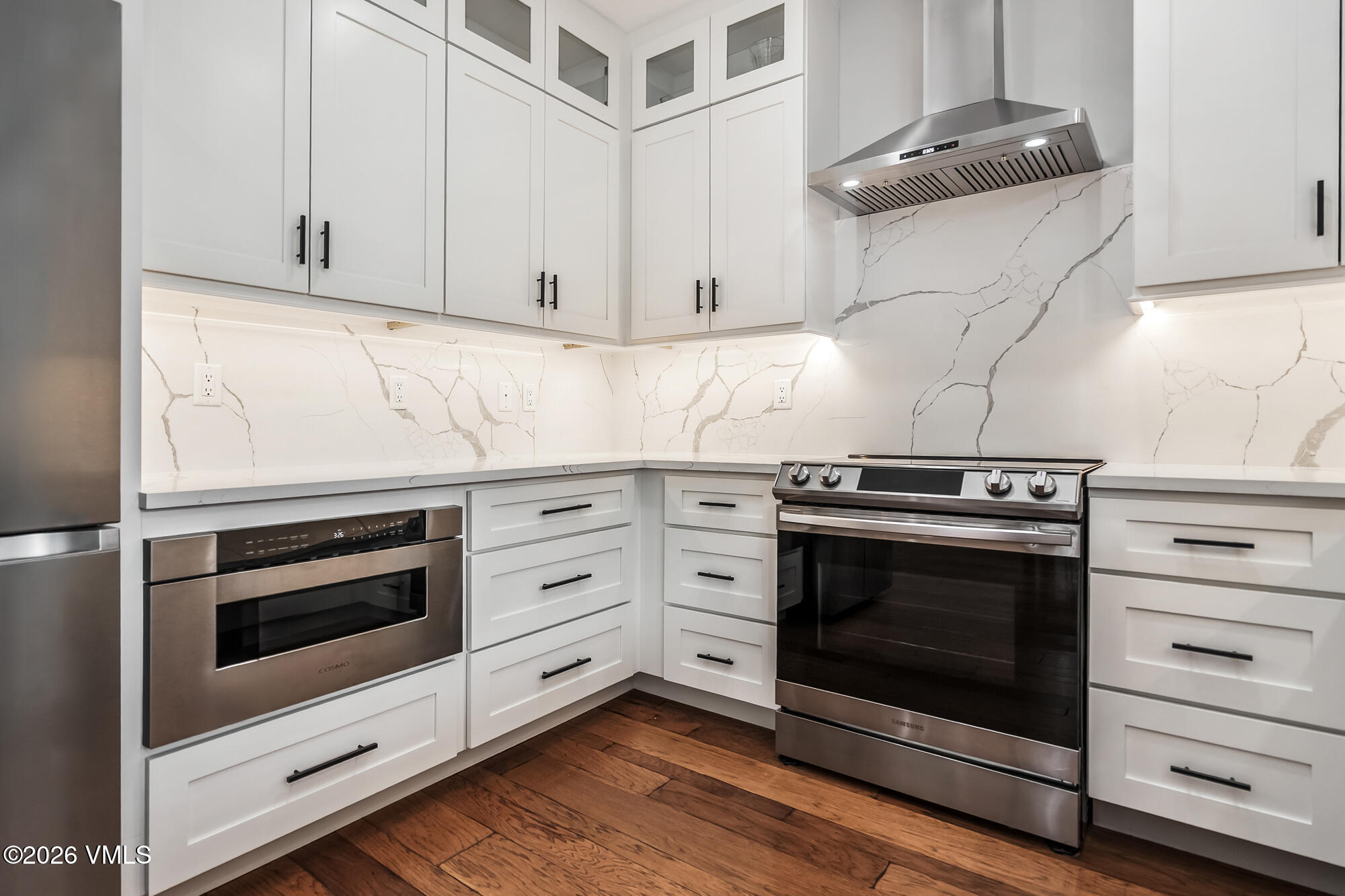 54 Field Street Eagle, CO 81631 - Photo 10 of 36 a stove top oven sitting inside of a kitchen