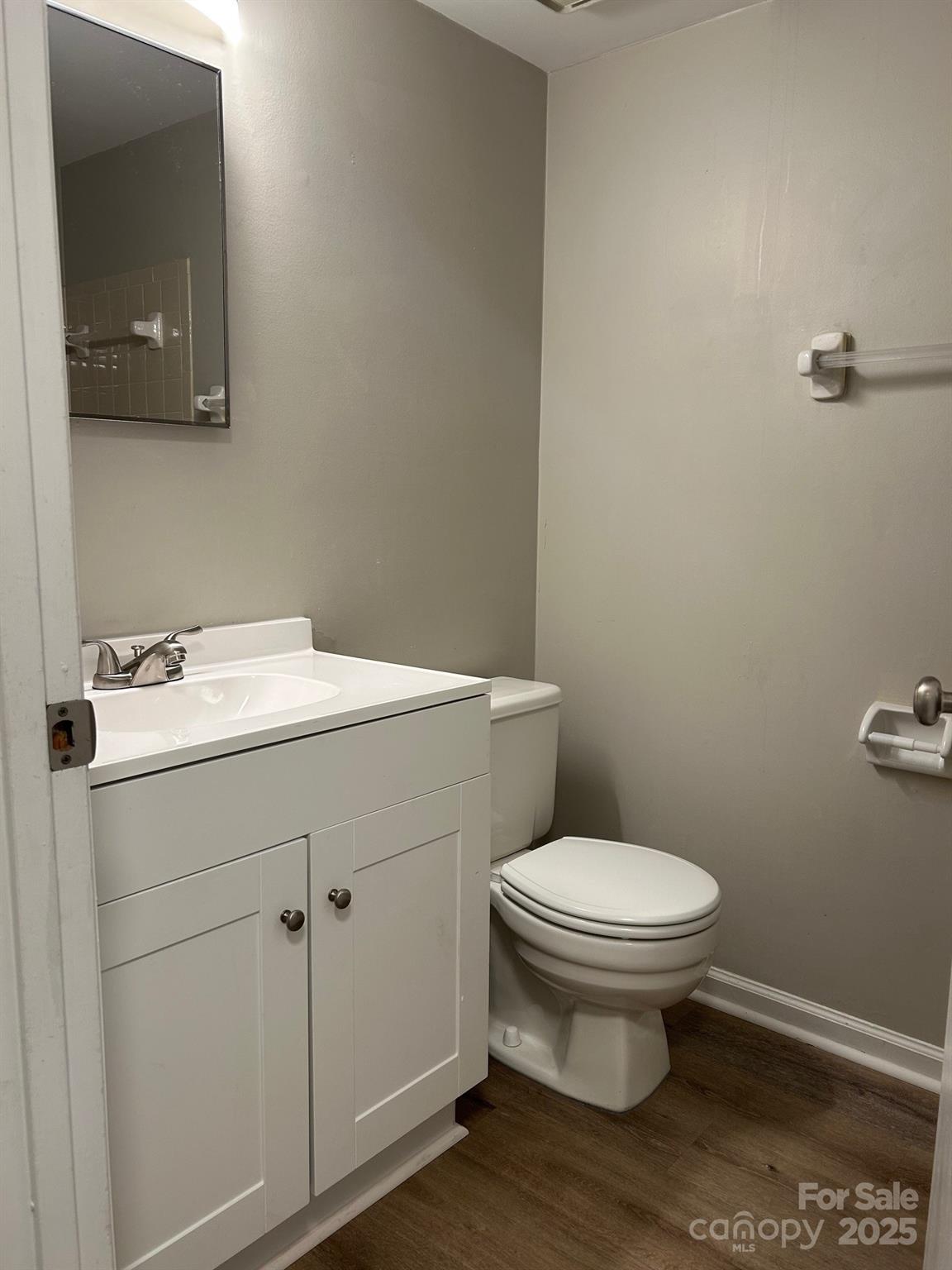 9401 Old Concord Road, Unit A Charlotte, NC 28213 - Photo 12 of 12 a bathroom with a sink toilet and vanity