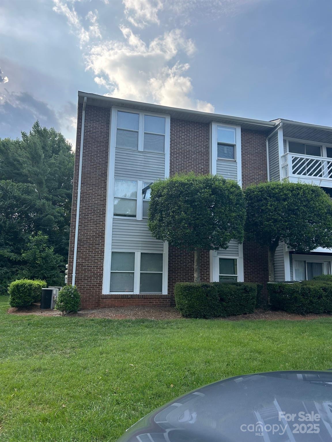 9401 Old Concord Road, Unit A Charlotte, NC 28213 - Photo 2 of 12 a front view of a house with a garden