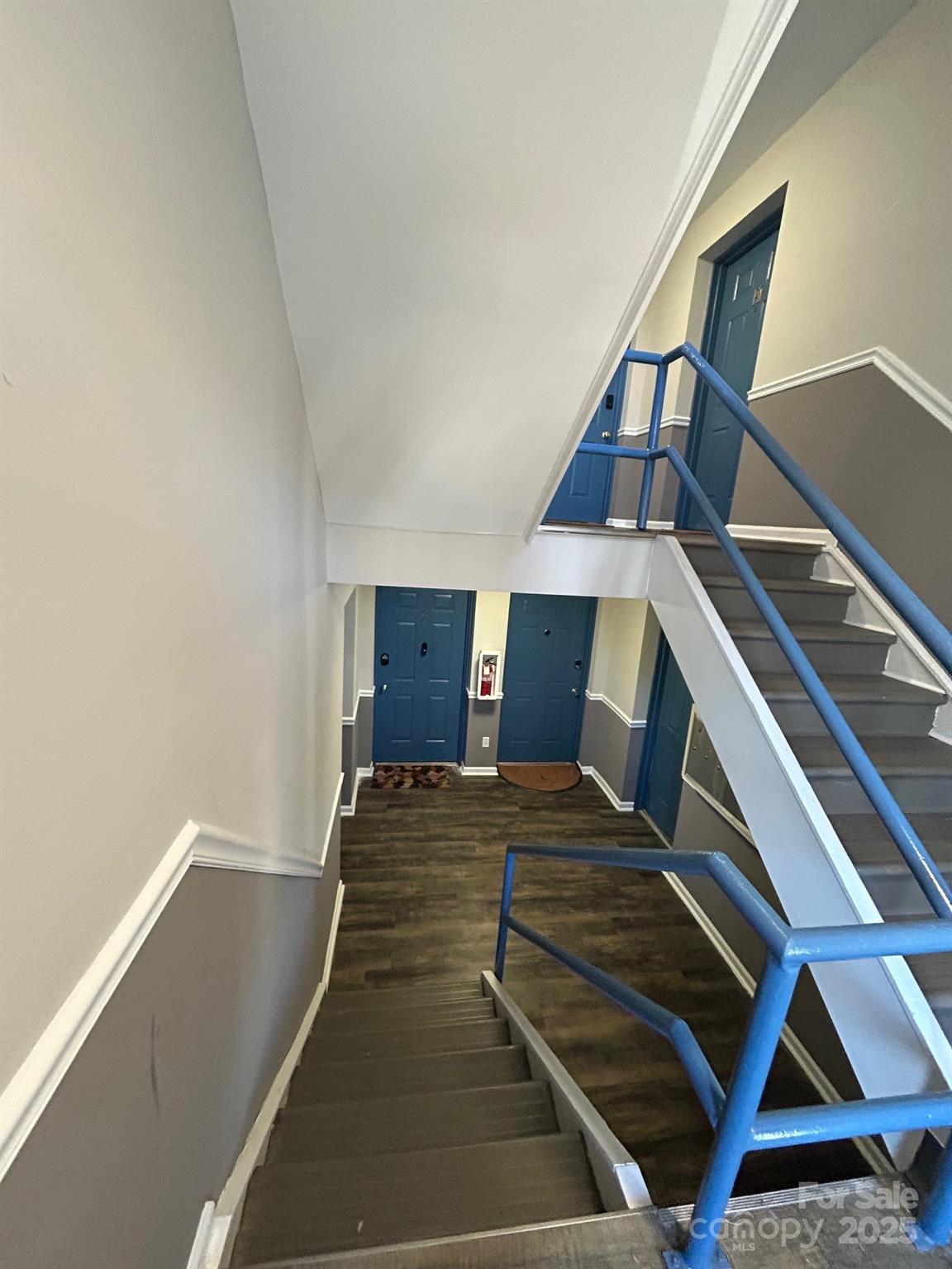 9401 Old Concord Road, Unit A Charlotte, NC 28213 - Photo 3 of 12 a bedroom with a bed and a balcony with wooden floor