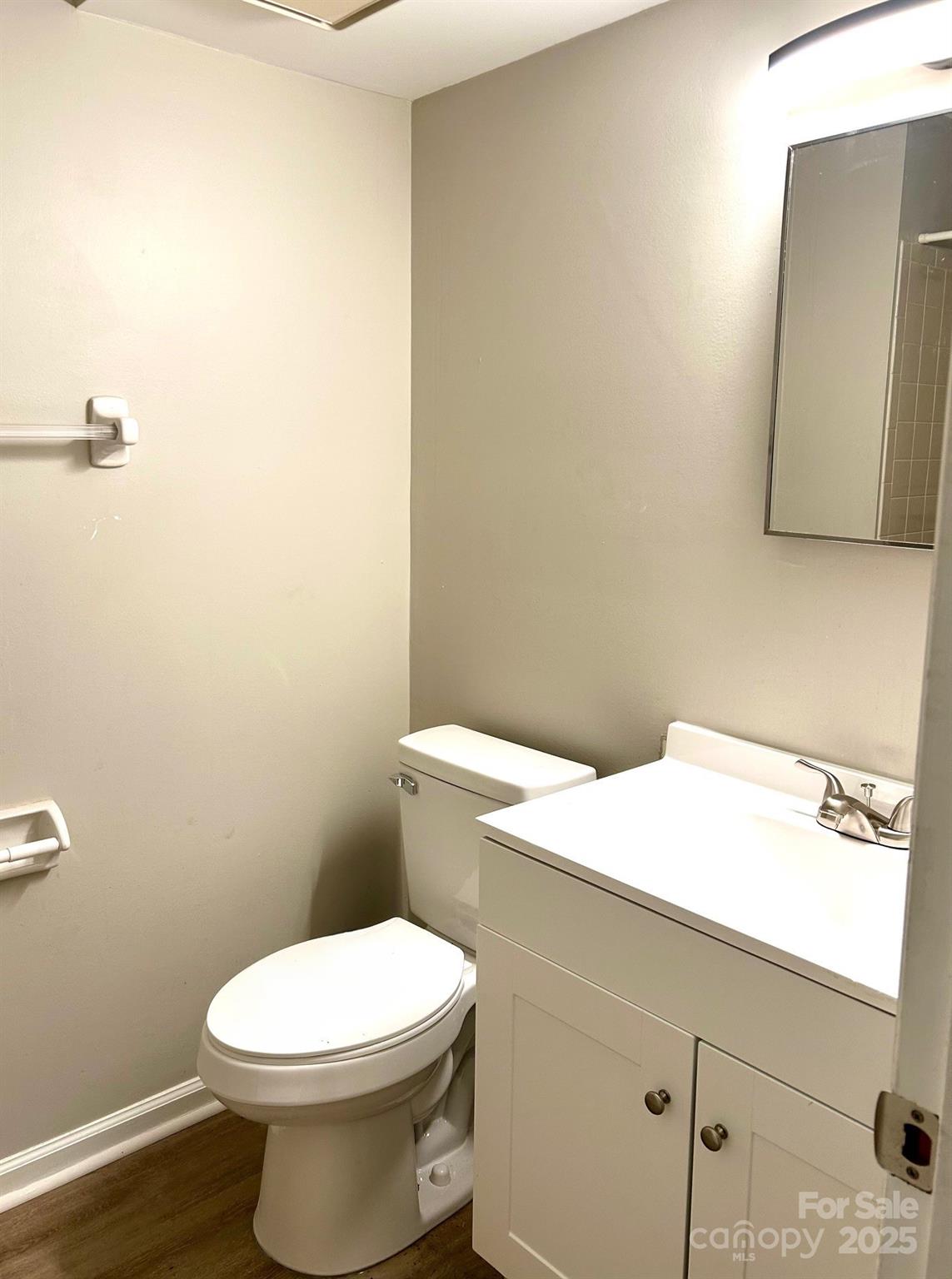 9401 Old Concord Road, Unit A Charlotte, NC 28213 - Photo 10 of 12 a white toilet sitting next to a bathroom sink
