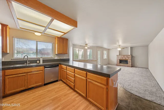 a view of a kitchen and refrigerator