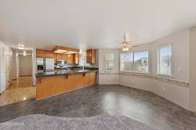 a view of a livingroom with a chandelier fan