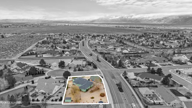 a view of a hallway with wooden floor and closet