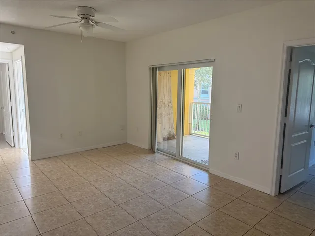 an empty room with a empty space and windows