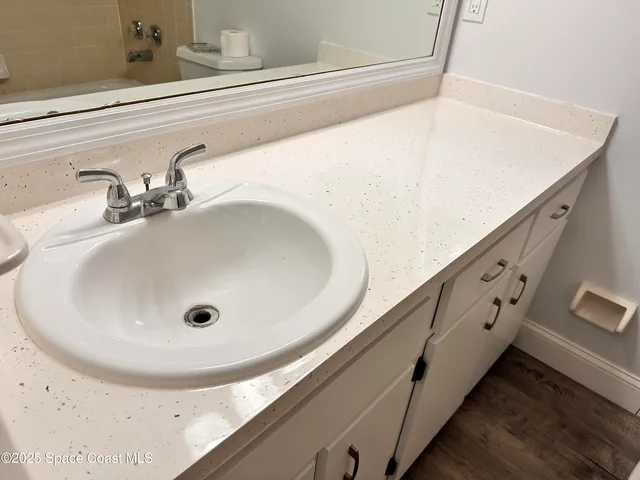 a bathroom with a sink and mirror
