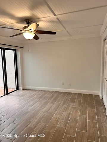 a view of an empty room with a mirror