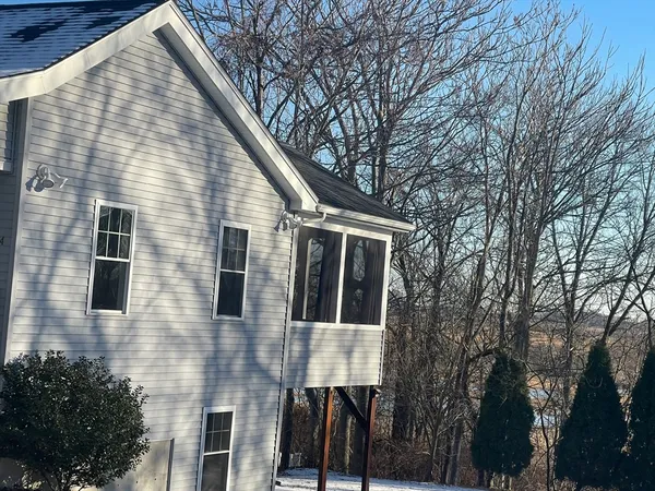 a view of a house with a yard