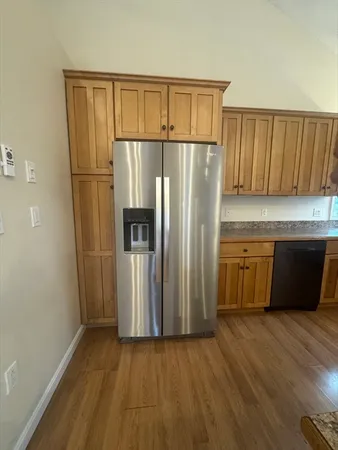 a view of entryway with wooden floor