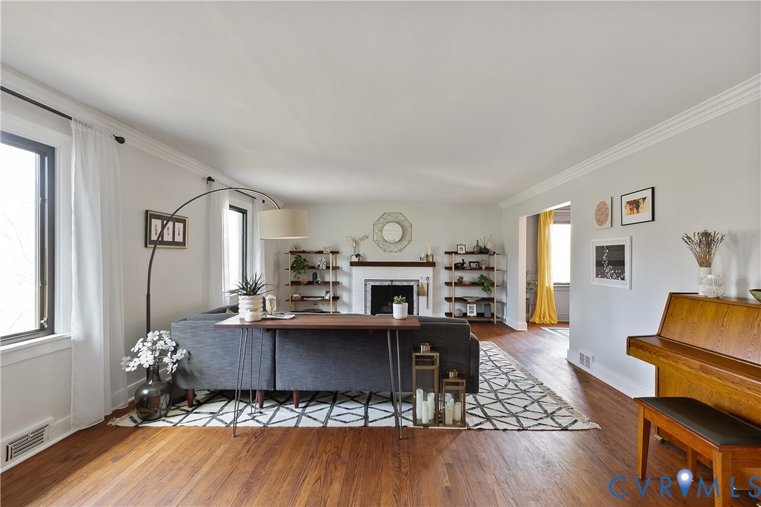 Large living room featuring wood-burning fireplace
