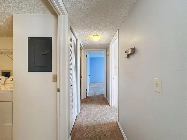 a bedroom with a balcony a bed and a window