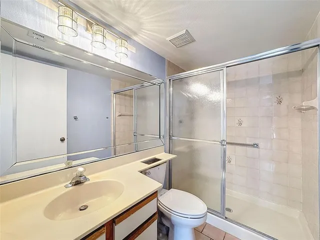 a bathroom with a shower and a toilet