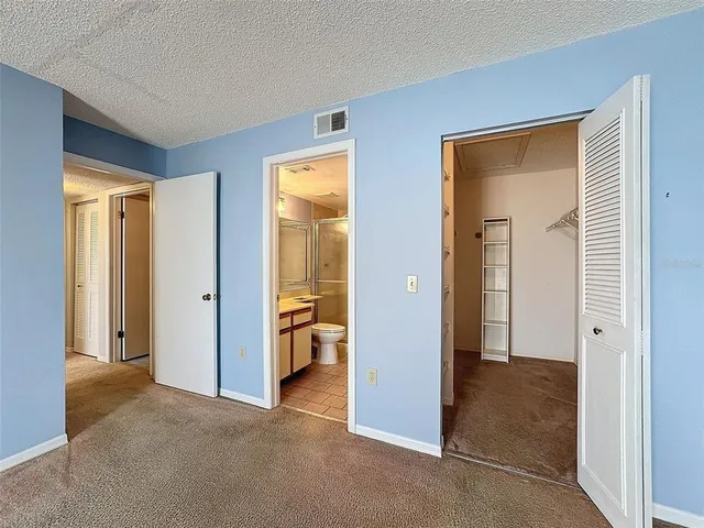a view of hallway with walk in closet