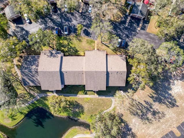 a view of a house with swimming pool and sitting area