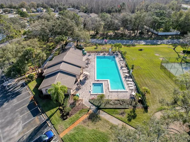 an aerial view of residential houses with outdoor space