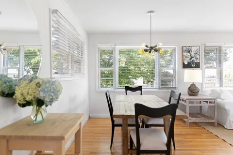 a view of a dining room with furniture window and outside view
