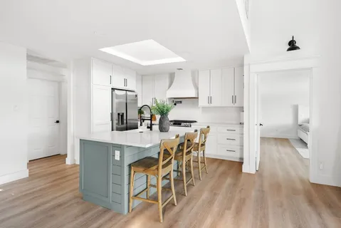 a kitchen with a table and chairs in it