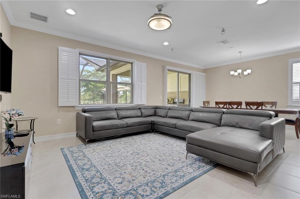 16309 Aberdeen Way Naples, FL 34110 - Photo 12 of 34 a living room with furniture and a large window