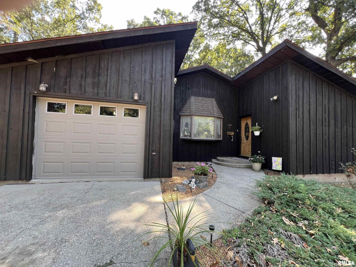 a backyard of a house with seating space