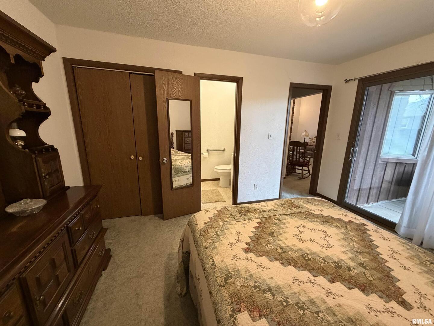 420 North 9th Street Benton, IL 62812 - Photo 13 of 26 a bedroom with a bed and a mirror