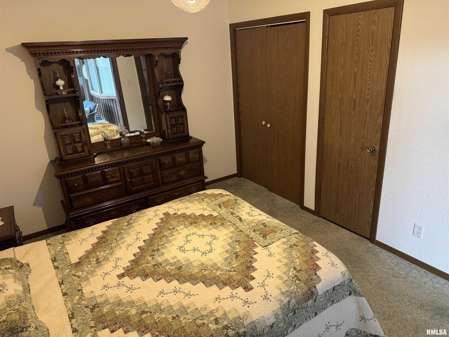 420 North 9th Street Benton, IL 62812 - Photo 14 of 26 a bedroom with a bed and wooden floor
