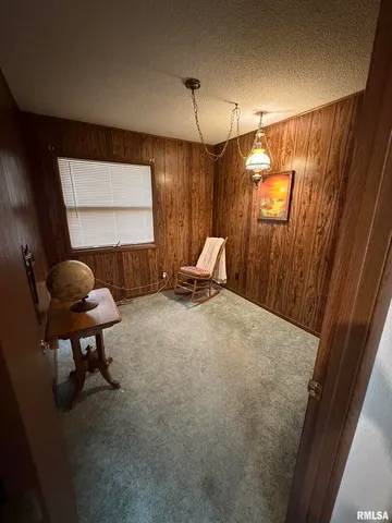 a workspace with furniture and window